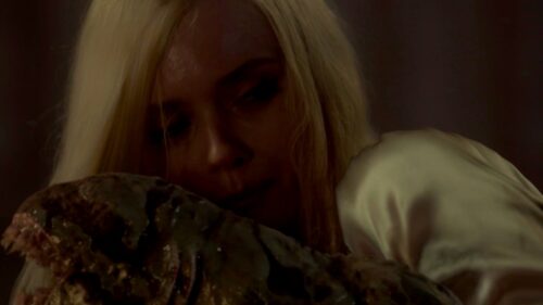 Christina and a newborn sloggoth in LOVECRAFT COUNTRY 1x02
