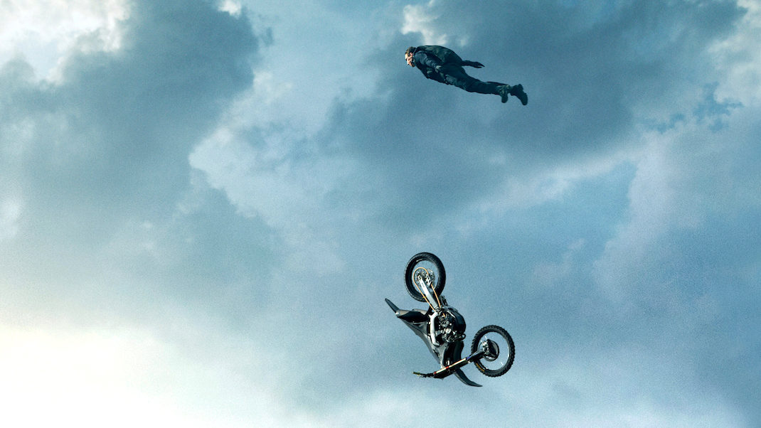 Tom Cruise and his motorcycle falling through the air in MISSION: IMPOSSIBLE - DEAD RECKONING PART ONE (2023)